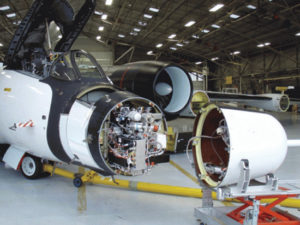 An airplane with the nose open, revealing mass spectrometer inside