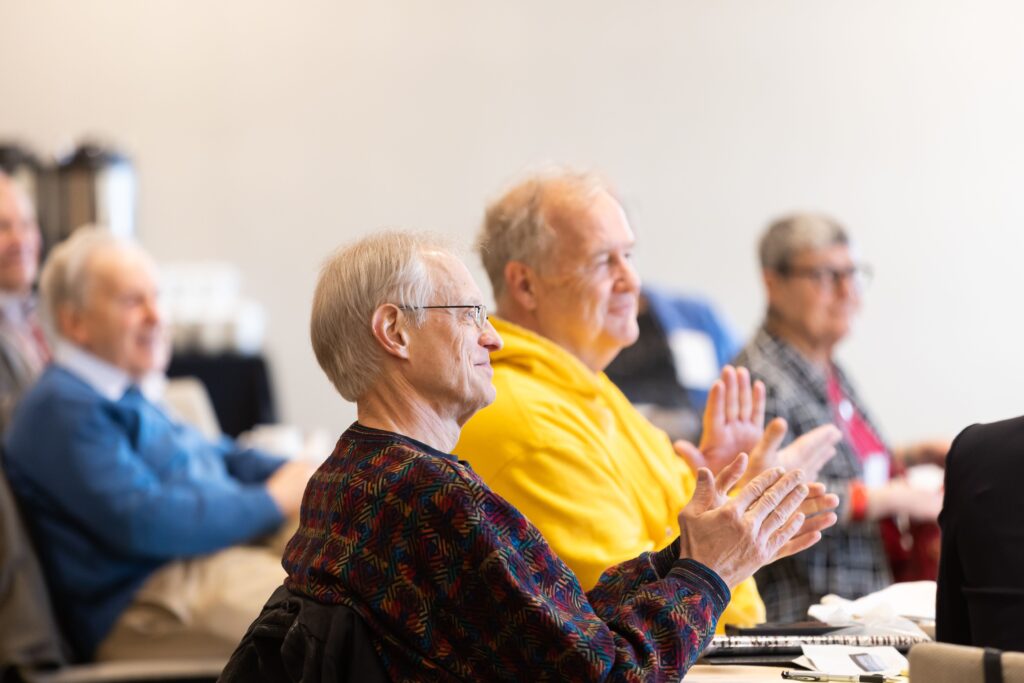 Robert Crane, Craig Carter, Lee Selwyn, and
Judy Selwyn sitting in the audience for the breakfast talk series